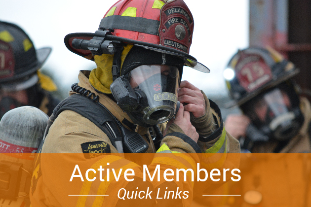 firefighter wearing full turnouts buckling their helmet with an orange box and white text on the bottom
