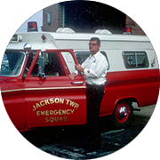 Firefighter standing next to a fire truck
